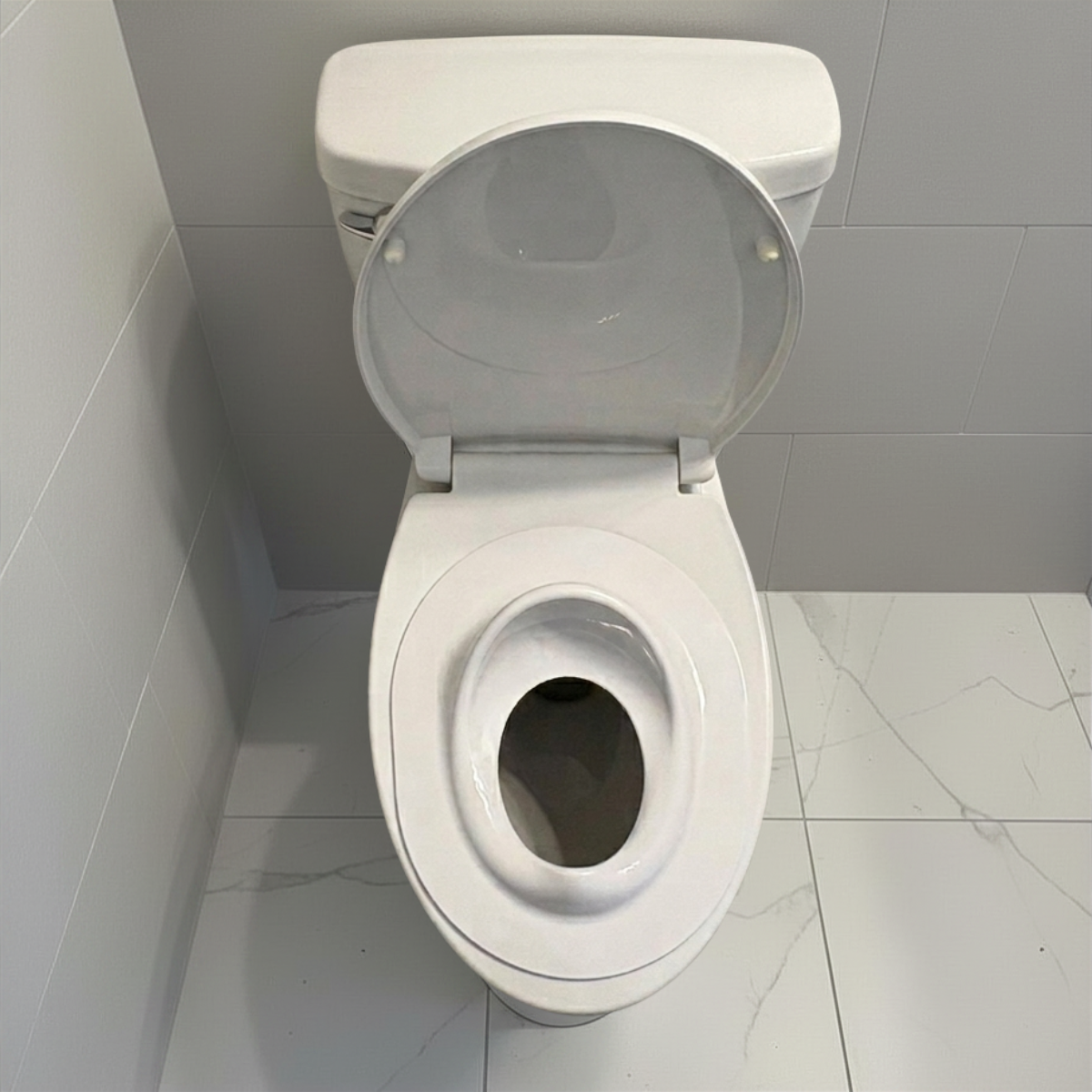 Tot Perch toddler toilet seat insert — quick-use method 2, resting on top of closed toilet seat