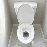 Tot Perch toddler toilet seat insert — bird's eye view, toilet lid closed over and locking it in place